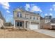 Charming brick two-story home with a two-car garage and well-manicured front lawn at 628 Leafy Branch Way, Mcdonough, GA 30253