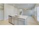 Kitchen island featuring modern cabinets, stainless dishwasher and quartz countertops at 628 Leafy Branch Way, Mcdonough, GA 30253