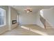 Open living room featuring wood floors, recessed lighting, fireplace, and a staircase leading to the upper level at 628 Leafy Branch Way, Mcdonough, GA 30253