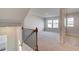 Bright loft area with carpet and two windows at 628 Leafy Branch Way, Mcdonough, GA 30253