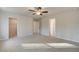 Main bedroom showing entry to walk-in closet and on-suite bathroom; neutral carpet and light grey walls throughout at 628 Leafy Branch Way, Mcdonough, GA 30253