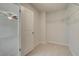 Walk-in closet space with wire shelving; bedroom view through door frame at 628 Leafy Branch Way, Mcdonough, GA 30253