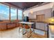 Modern kitchen with gray cabinets, an island, and exposed brick at 660 Glen Iris Ne Dr # 204, Atlanta, GA 30308