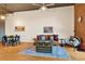 Living room with exposed brick wall, hardwood floors, and seating area at 660 Glen Iris Ne Dr # 204, Atlanta, GA 30308