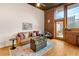 Living room with exposed brick wall and hardwood floors at 660 Glen Iris Ne Dr # 204, Atlanta, GA 30308