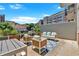 Private patio with modern furniture and city views at 660 Glen Iris Ne Dr # 204, Atlanta, GA 30308