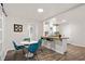 Dining area open to a modern kitchen with stainless steel appliances and a butcher block countertop at 1303 Rock Springs St, Forest Park, GA 30297