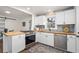 Stylish kitchen, featuring butcher block countertops and white cabinets at 1303 Rocksprings St, Atlanta, GA 30297