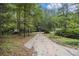 Long driveway leading to a wooded residential property at 170 Pebble Path, Douglasville, GA 30134