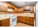 Retro kitchen featuring wood cabinets and appliances at 170 Pebble Path, Douglasville, GA 30134