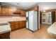 Retro kitchen with wood cabinets and tiled floor at 170 Pebble Path, Douglasville, GA 30134