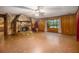 Living room featuring a stone fireplace and wood walls at 170 Pebble Path, Douglasville, GA 30134