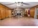 Spacious living room with a stone fireplace and wood paneling at 170 Pebble Path, Douglasville, GA 30134