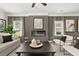 Spacious living room featuring a fireplace and large windows at 12 Jacobs Farm Ln # 6, Lawrenceville, GA 30043