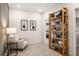 Cozy sitting area with a comfortable chair and a wooden bookshelf at 12 Jacobs Farm Ln # 6, Lawrenceville, GA 30043