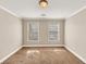 Well-lit bedroom featuring neutral walls and carpet at 2812 Havenwood Dr, Conyers, GA 30094