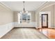 Formal dining room with hardwood floors and large windows at 2812 Havenwood Dr, Conyers, GA 30094