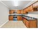 Kitchen with wood cabinets and tile floors at 2812 Havenwood Dr, Conyers, GA 30094