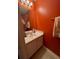 Simple bathroom with sink and orange walls at 331 Overlook Turn Northwest, Conyers, GA 30012