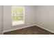 Bright bedroom with large window and tile flooring at 5377 Martins Crossing Rd, Stone Mountain, GA 30088