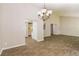 Spacious dining area with tile floors and chandelier at 5377 Martins Crossing Rd, Stone Mountain, GA 30088