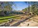 Home's back exterior and backyard with firepit at 1714 Fort Valley Sw Dr, Atlanta, GA 30311