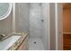 This bathroom features tiled walk-in shower and granite countertop at 2980 Laguna Dr, Decatur, GA 30032