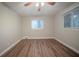 Comfortable bedroom with wood floors, neutral walls, and a ceiling fan, ready for personal touches at 2980 Laguna Dr, Decatur, GA 30032