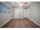 Bright bedroom features modern flooring, a ceiling fan, and multiple closets for ample storage at 2980 Laguna Dr, Decatur, GA 30032