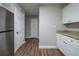 Well-lit kitchen features stainless steel refrigerator, stylish counters, and ample storage at 2980 Laguna Dr, Decatur, GA 30032