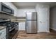 Efficient kitchen space featuring stainless steel appliances, granite counters, and sleek cabinetry at 2980 Laguna Dr, Decatur, GA 30032