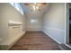 Spacious living room with wooden floors, fireplace, and ample natural light from the windows at 2980 Laguna Dr, Decatur, GA 30032