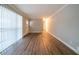 Spacious living room featuring stylish wood floors, natural light, and a fresh, neutral color palette at 2980 Laguna Dr, Decatur, GA 30032