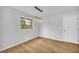 Simple dining room with new flooring and modern light fixture at 3594 Hillsborough Ln, Decatur, GA 30032