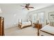 Charming bedroom with twin beds, a ceiling fan, and neutral decor at 1031 Eulalia Ne Rd, Atlanta, GA 30319