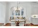 Cozy dining area featuring built-in seating, wood table, and decorative chandelier at 1031 Eulalia Ne Rd, Atlanta, GA 30319