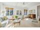 Sunlit living room with neutral tones, plush seating, and elegant windows at 1031 Eulalia Ne Rd, Atlanta, GA 30319