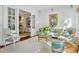 Elegant living room with neutral tones, plush seating, and french doors at 1031 Eulalia Ne Rd, Atlanta, GA 30319