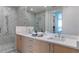 Modern bathroom with marble shower and double vanity at 2425 Peachtree Road # 1008, Atlanta, GA 30305