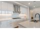 Modern kitchen with white cabinets, quartz countertops and stainless steel appliances at 2425 Peachtree Road # 1008, Atlanta, GA 30305