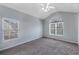 Bedroom featuring carpet, natural lighting, and a ceiling fan for added comfort at 287 Jenna Ln, Dallas, GA 30157