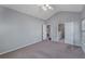 Bedroom with neutral walls, plush carpet, ceiling fan, and access to an ensuite bathroom at 287 Jenna Ln, Dallas, GA 30157