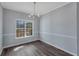 Bright dining room with hardwood floors and chandelier at 287 Jenna Ln, Dallas, GA 30157