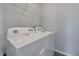 Laundry room with washer, dryer and overhead shelving at 287 Jenna Ln, Dallas, GA 30157