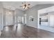 Spacious living room featuring hardwood floors, high ceilings, modern lighting, and open layout to the kitchen at 287 Jenna Ln, Dallas, GA 30157