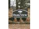 Stone entrance sign to Park View featuring manicured bushes and lush landscaping at 4815 Diggers Way, Sugar Hill, GA 30518