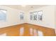 Well lit bedroom with hardwood floors and multiple windows at 1069 Saint James Ne Xing, Atlanta, GA 30319