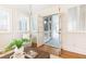 Bright sunroom with hardwood floors and white trim, with a screened porch visible through french doors at 1069 Saint James Ne Xing, Atlanta, GA 30319