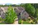 Aerial shot of the brick home featuring manicured landscaping and paved driveway at 4508 Oakside Pt, Marietta, GA 30067