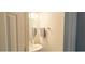 Small, updated half bathroom with oval mirror at 5800 Oakdale Rd # 103, Mableton, GA 30126